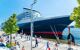 Queen Mary 2 in port with people on the dock