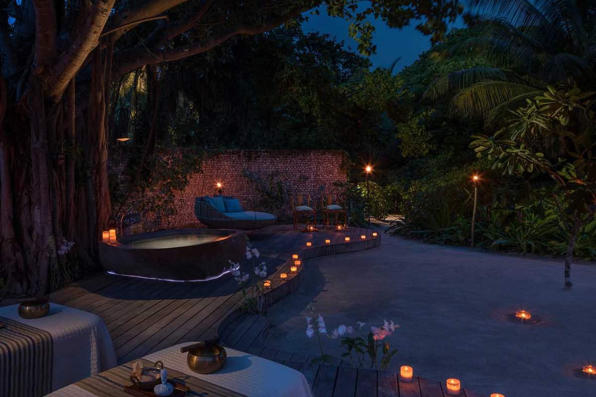 a spa setting at night with candles