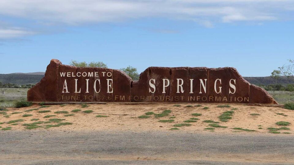 A sign welcoming travelers to Alice Springs, a town in NT, Australia.