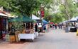 People are shopping at the weekly sunday street market with handicrafts, Aboriginal art, food, drinks in Alice Springs