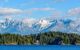 Fantastic view over ocean, snow mountain and rocks at Sechelt inlet in Vancouver, Canada.