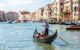 Gondola on Canal Grande in Venice, in a beautiful summer day in Italy