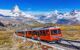 Zermatt, Switzerland. Gornergrat tourist train with Matterhorn peak in the background.