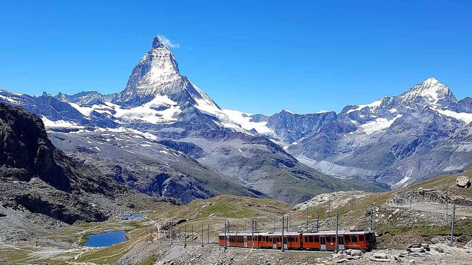 The mountain train from Zermatt up to Gornergrat. Lovely view of the Matterhorn and the small lake Riffelsee. The Gornergrat bahn. Summer in the swiss alps. Switzerland.